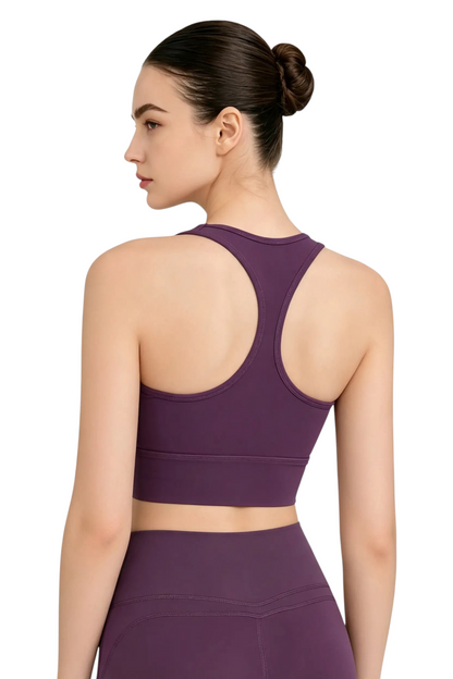 Vue arrière d'une brassière de sport violette JOY-STYLE Active Sculpt avec dos nageur et bande élastique