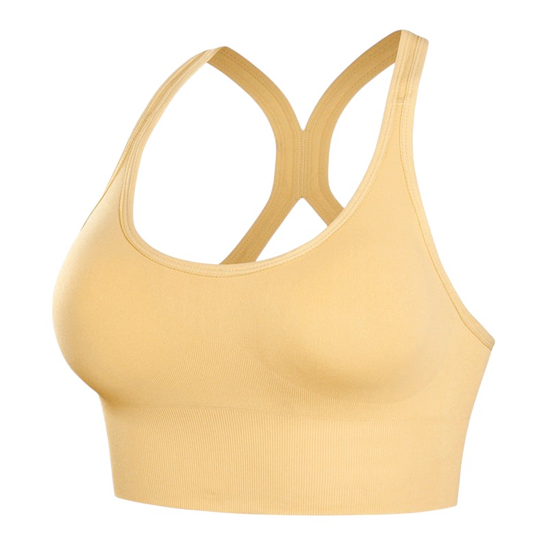 Brassière de sport JOY-STYLE beige à dos nu, conçue pour un maintien renforcé et un confort optimal lors de l'effort.