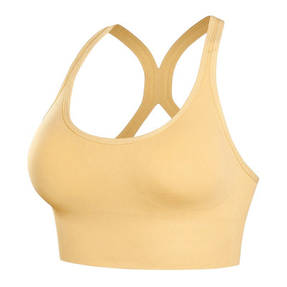 Brassière de sport JOY-STYLE beige à dos nu, conçue pour un maintien renforcé et un confort optimal lors de l'effort.
