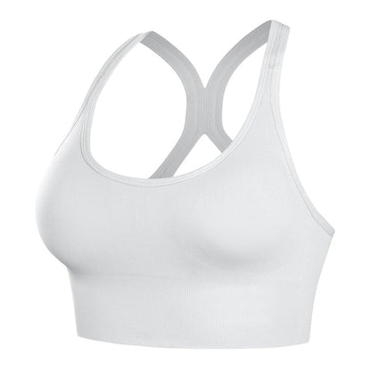 Brassière de sport blanche JOY-STYLE Curve Active à dos nageur, offrant un maintien renforcé et un confort respirant.