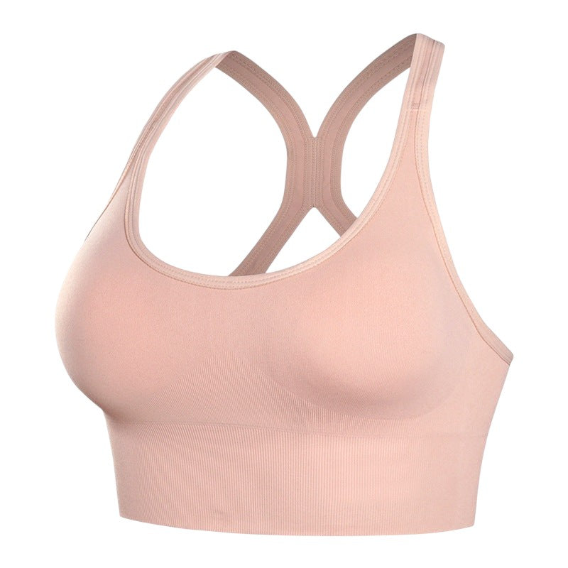 Brassière de sport JOY-STYLE rose poudré à dos nageur, offrant un maintien renforcé et un confort seconde peau.