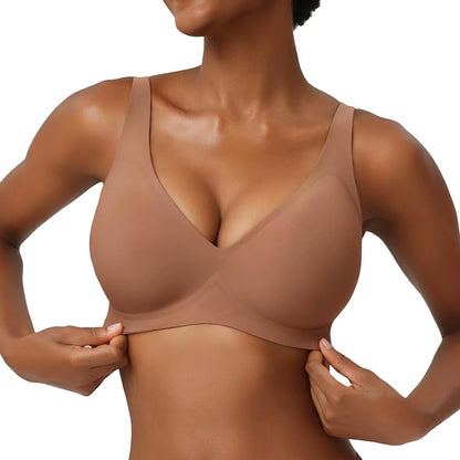 JOY-STYLE nude seamless plunge bra with adjustable straps and a sculpted fit.
