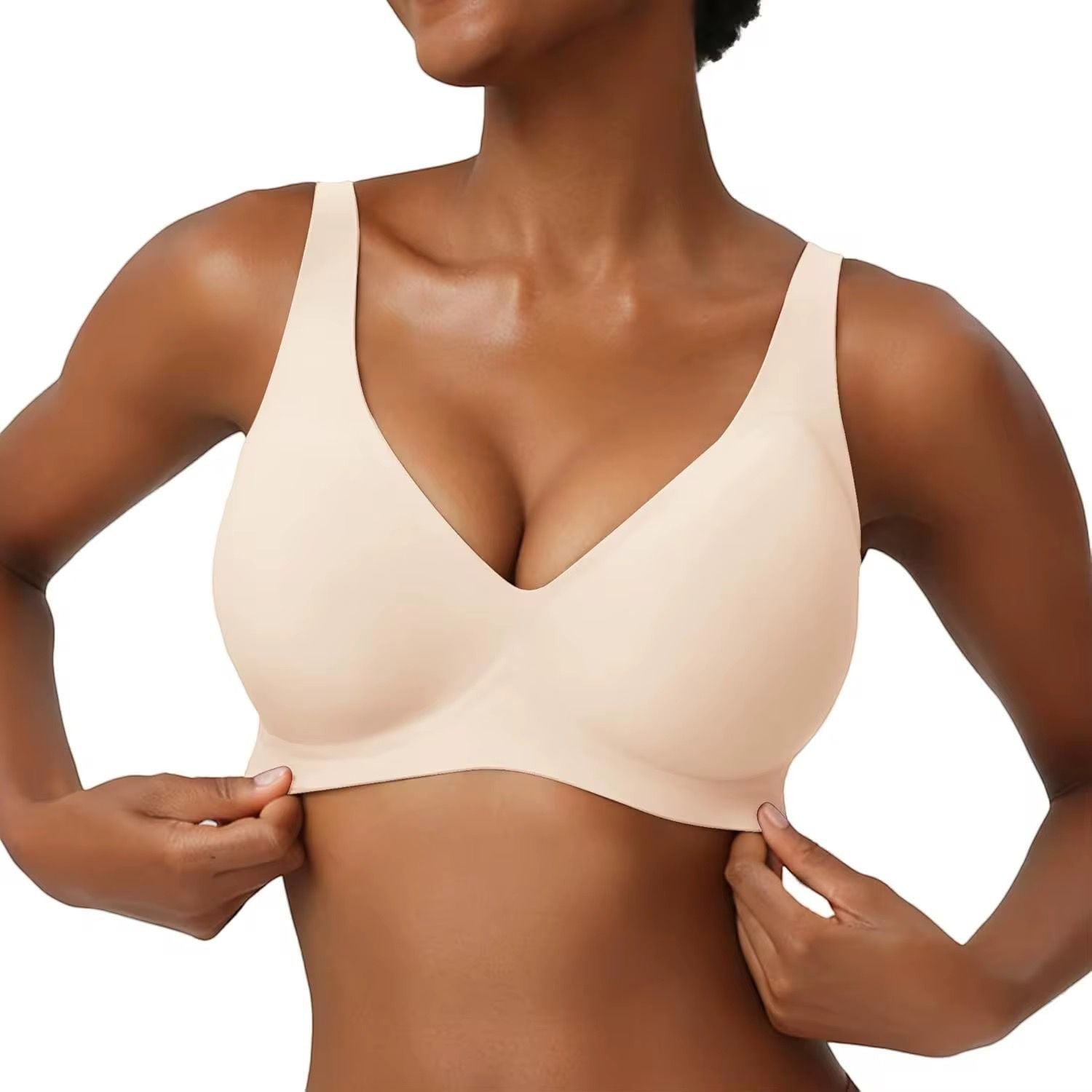 JOY-STYLE nude seamless plunge bra with wide straps and a sculpted fit, made of soft, stretchy material.